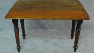 A Victorian mahogany drop flap pembroke table on turned tapering supports. H.65 W.89 D.59cm