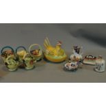 A collection of Art Deco Tuscan Decoro pottery baskets and other ceramic items.