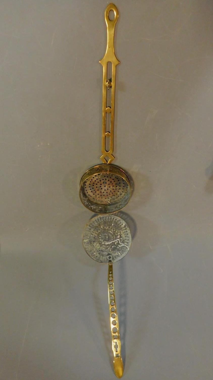 Two 19th century brass lidded strainers and a brass trivet. W.58 (widest) - Image 3 of 6