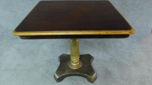 An early 19th century tilt top table with gilt highlighted top and central pedestal. H.74 W.73 D.