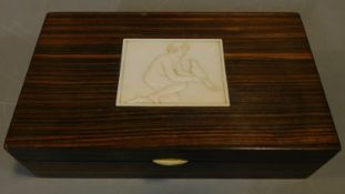 An Art Deco rosewood jewellery box with signed inlaid panel of a girl with a dove. H.5 W.19 D.11cm