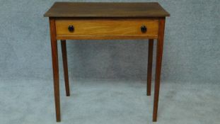 A Georgian mahogany single drawer side table on square section supports. H.74 W.76 D.50cm