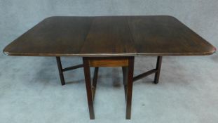 A mahogany drop flap dining table on square stretchered supports. H.77 W.175 D.121cm