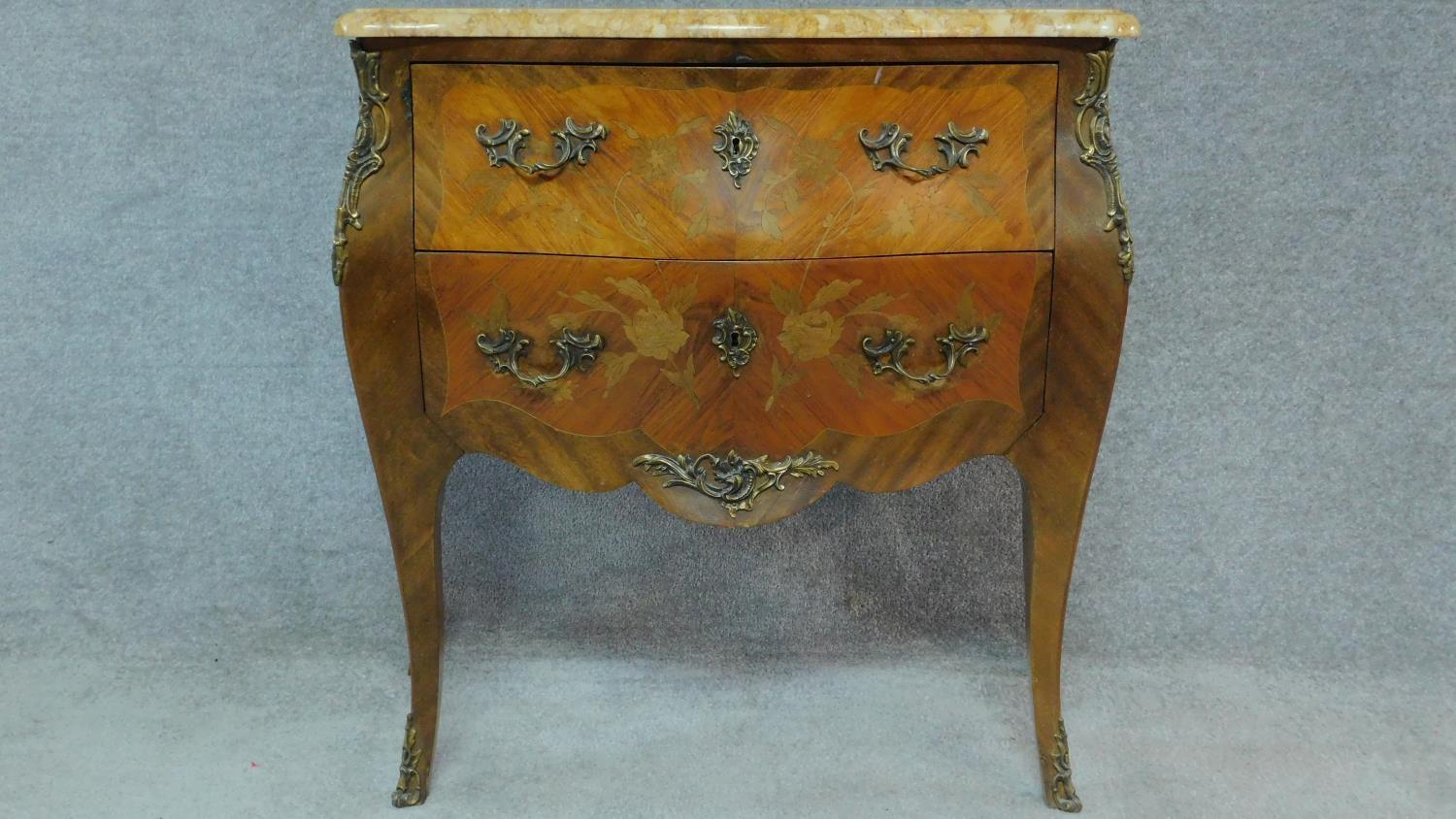 A Louis XV style kingwood marquetry floral and foliate inlaid commode with moulded marble top
