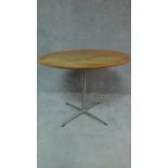 A circular Danish teak Fritzhansen centre table on metal quadruped supports,