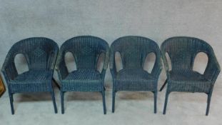 A set of four wicker conservatory armchairs. H.78cm