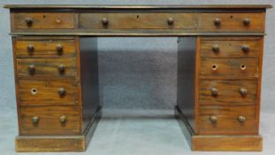 A 19th century mahogany pedestal desk with an arrangement of nine drawers on plinth base. H.77 W.137