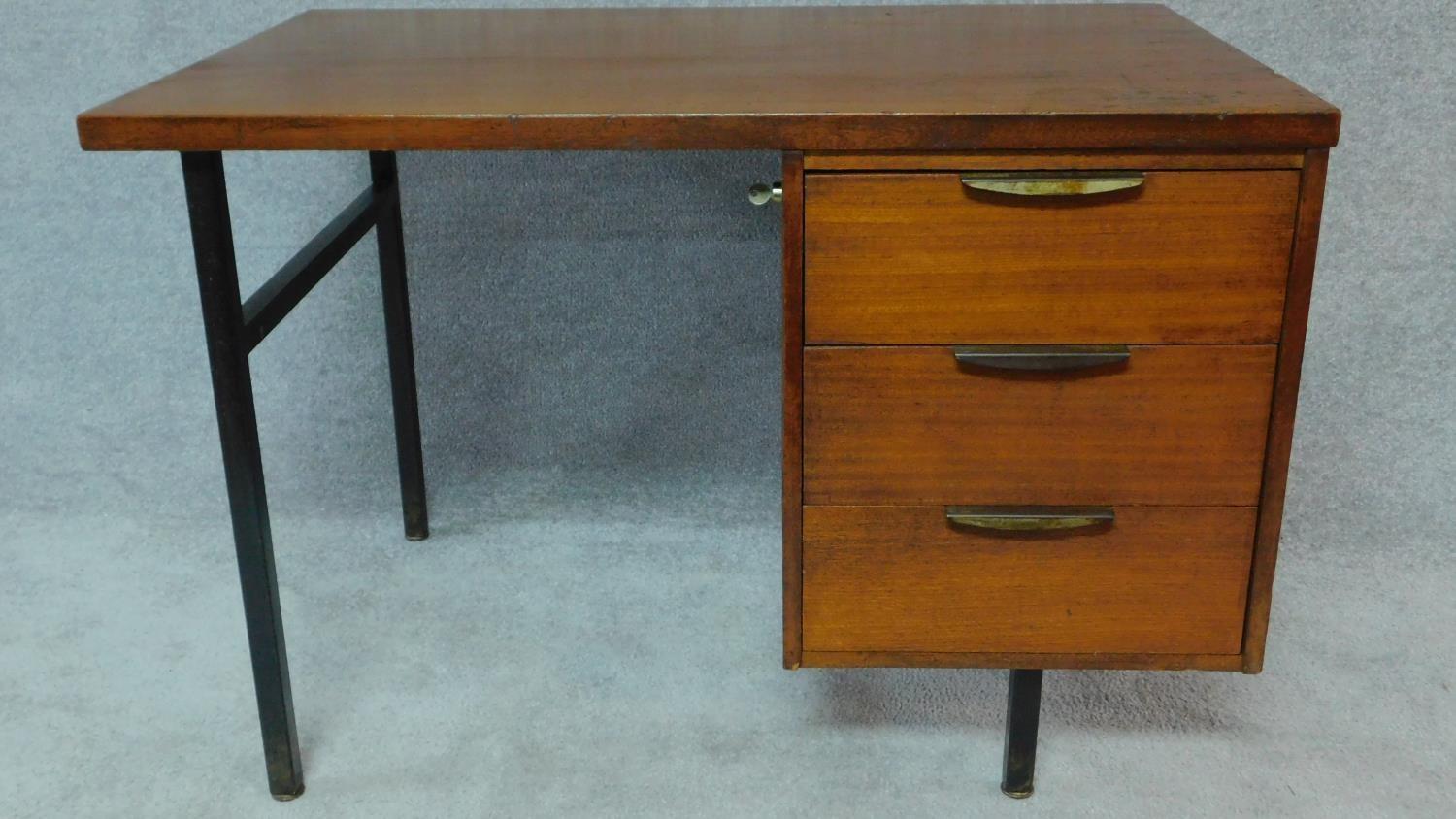 A 1950's vintage teak and metal framed pedestal desk by evertaut formula furniture, stamped to the