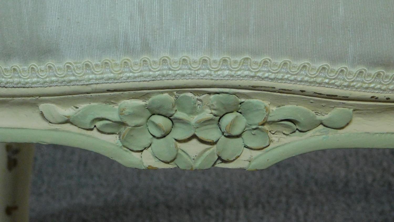 A carved and painted fauteuil in ivory damask on cabriole supports. H.86cm - Image 6 of 9