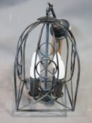 A birdcage ceiling light pendant with antique finish. H 48 cm