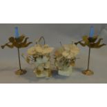 A pair of brass cherub candlesticks and a pair of mother of pearl flower arrangements. H.40cm (
