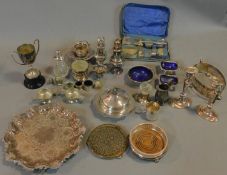 A miscellaneous collection of silver plated items, to include; pair candlesticks, embossed tray,