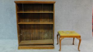 An oak open bookcase and a Georgian style stool. H.122 W.97 D.31cm (bookcase)