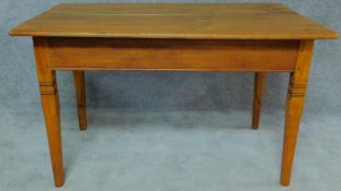 A late nineteenth century Boekenhout planked and jointed refectory style dining table on tapering