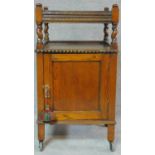 A mid 20th century oak pot cupboard with barleytwist supports. H.81 W.45 D.40