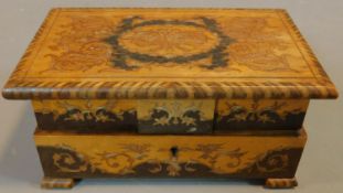An inlaid Sorrento musical jewellery box with mirrored buttoned interior. H.10 W.20 D.12cm
