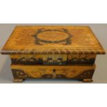 An inlaid Sorrento musical jewellery box with mirrored buttoned interior. H.10 W.20 D.12cm