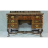 An early 20th century walnut Dutch style kneehole writing desk H.77 W.115 D.46cm