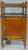 A mid 20th century oak pot cupboard with barleytwist supports. H.81 W.45 D.40