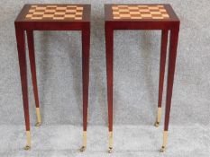 A pair of chess top inlaid occasional tables on tapering square section supports terminating in