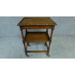 A mid 20th century oak two tier trolley on casters. H. 84cm W. 43cm L. 61cm