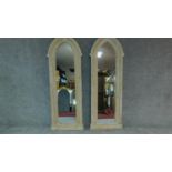 A pair of large arched Gothic style mirrors in limed cedar frames. H.173cm