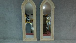 A pair of large arched Gothic style mirrors in limed cedar frames. H.173cm