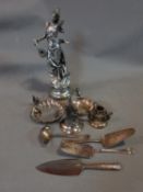 A collection of silver plate and a metal sculpture, including squirrel related items, cutlery and