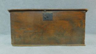 An antique elm coffer with hinged top and iron lock. H.36cm W.66cm D.36cm