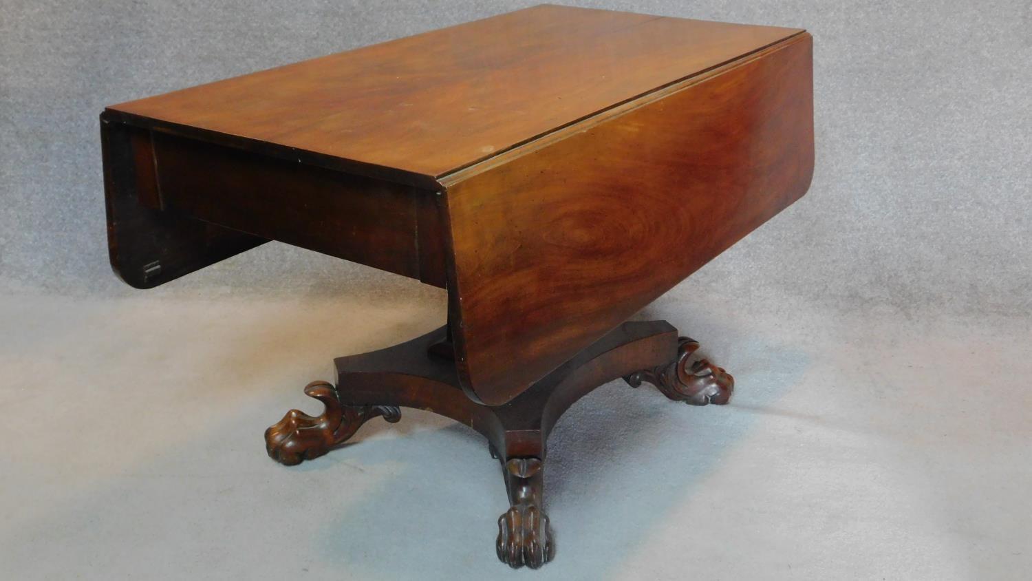 An early 19th century mahogany drop flap dining table fitted end drawer on quadruped platform base - Image 2 of 4