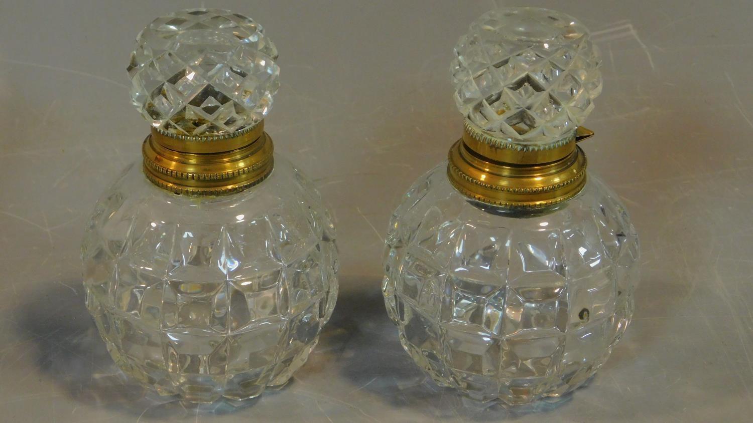 A pair of cut crystal scent bottles with gilt metal collars and a collection of other similar items. - Image 2 of 4