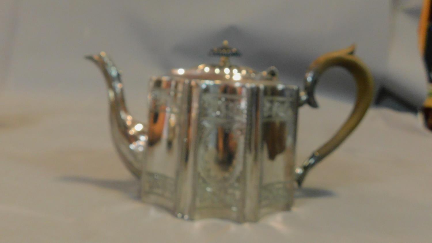 A collection of silver plated tea pots and jugs and a brass kettle, some with ebony handles. - Image 7 of 7