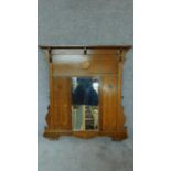 A 19th century oak overmantel mirror inlaid with Art Nouveau style motifs. H.100 W.93cm