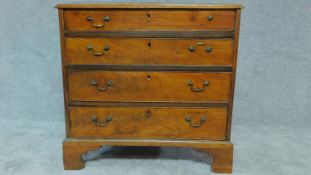 A Georgian mahogany chest of four long drawers. H.82 W.84 D.44cm