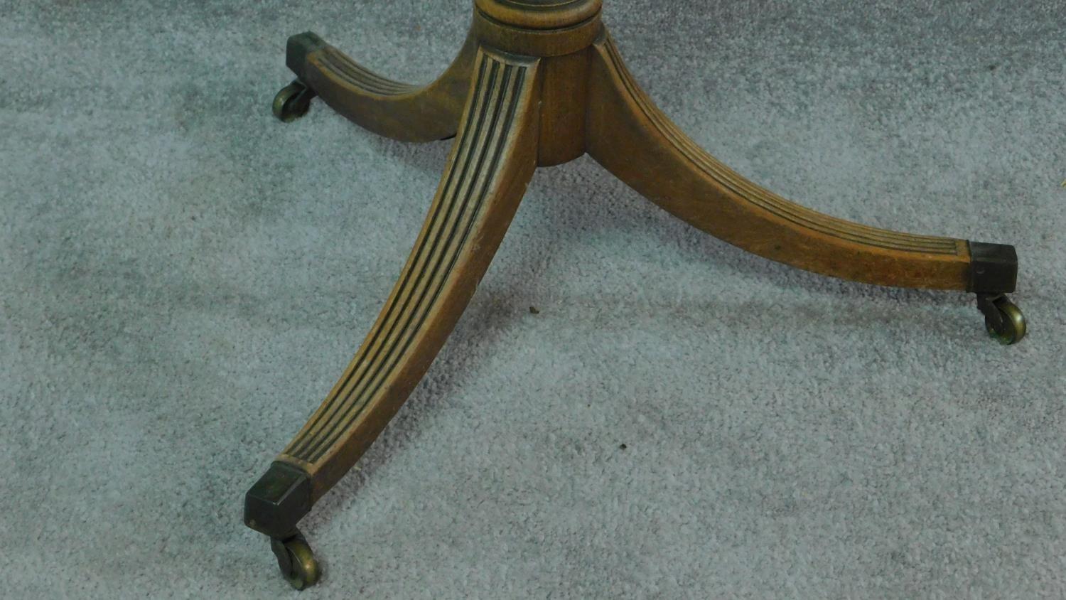 A Regency mahogany centre table with shaped octagonal top on turned column and swept reeded tripod - Image 3 of 5