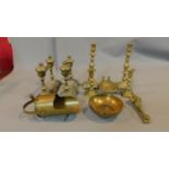 A collection of brass items including two pairs of candlesticks, a trench art miniature coal scuttle