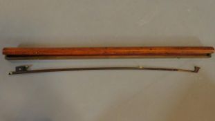 A violin bow in mahogany case. W.73cm