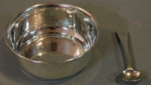 A hallmarked silver bowl, makers mark SJ, London,1905 and a Georgian spoon, maker JB. H.4 W.10 D.