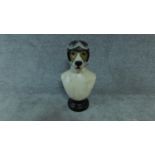 A moulded and polychrome bust of a vintage style canine racer. H.49cm