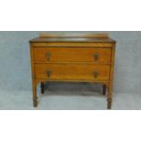 A mid 20th century oak chest of two long drawers. H.81 W.90 D.45cm