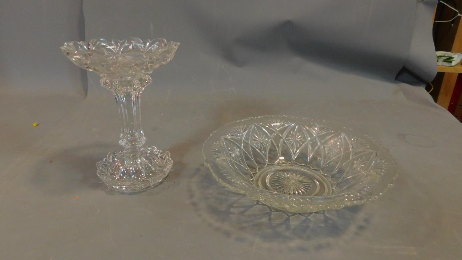 A pair of cut glass items, including vase and bowl.