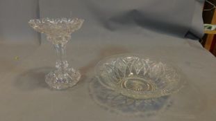 A pair of cut glass items, including vase and bowl.