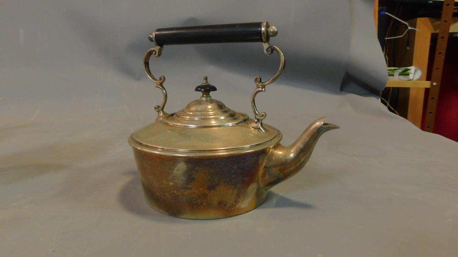 A collection of silver plated tea pots and jugs and a brass kettle, some with ebony handles. - Image 3 of 7