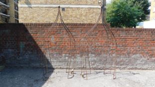 A pair of shaped metal garden arches H.230cm