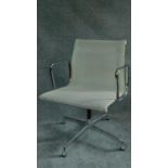 An Eames style white mesh office armchair by Vitra. H.85cm