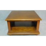 A teak low table with undertier. H.41 W.70 D.69cm