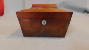 A Regency mahogany two section sarcophagus shaped tea caddy. H.15cm W.23cm D.12cm (lid detached)