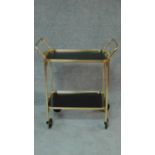 A 1970's vintage gilt metal two tier drinks trolley. H.81 W.70 D.38cm