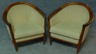 A pair of mid 20th century Danish teak armchairs by Broderna Anderssons with makers label to
