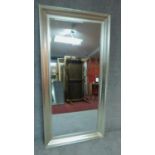 A full height pier mirror with silvered frame fitted bevelled glass. H.173cm